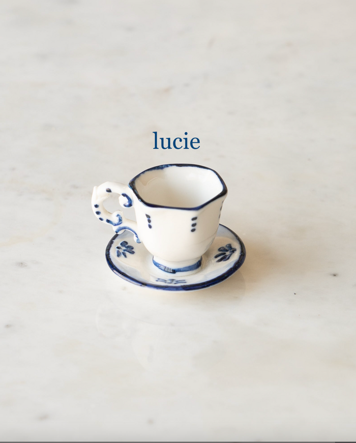 Tiny hexagonal tea cup and saucer with blue and white flower, "lucie".