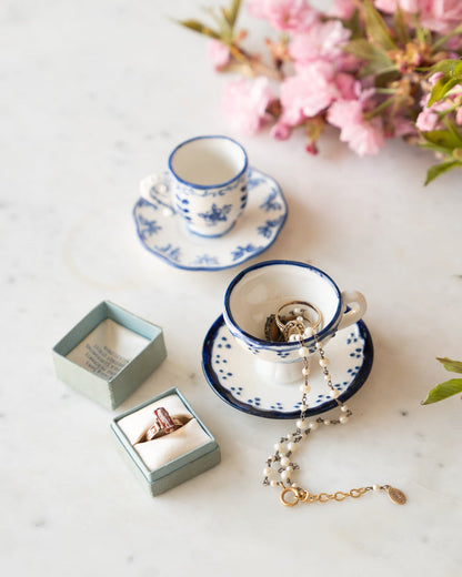 Set of tiny petite tea cup and saucer with blue and white flower details,  with jewlery inside.