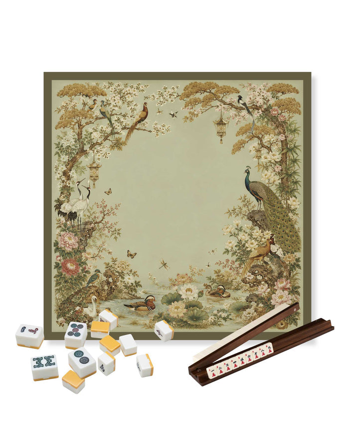 Square table mat with framed garden peacock scene, beige background and brown border