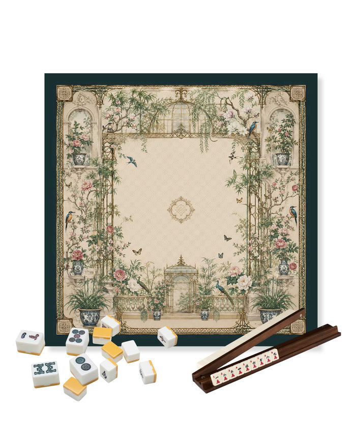 Square mahjong table mat with floral garden artwork; mahjong tiles and rack placed on it