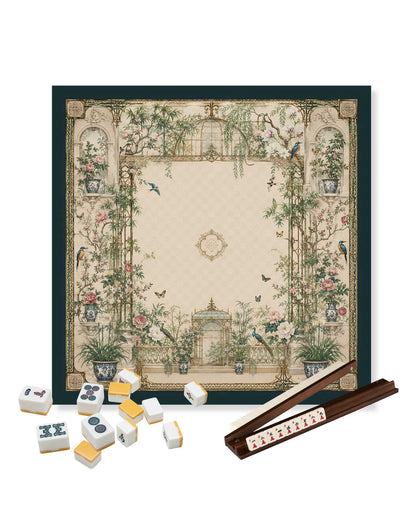 Square mahjong table mat with floral garden artwork; mahjong tiles and rack placed on it