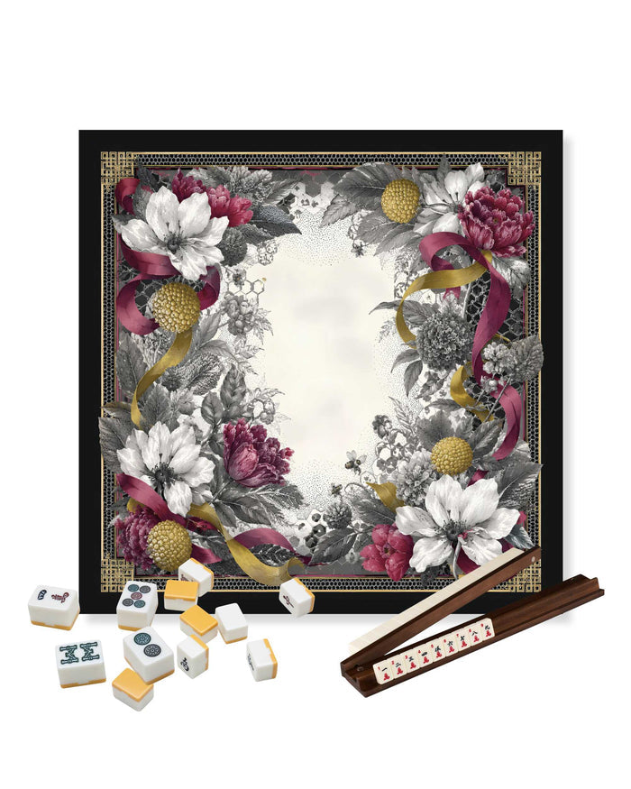 Square mahjong table mat with black border, white floral center, set of tiles and racks