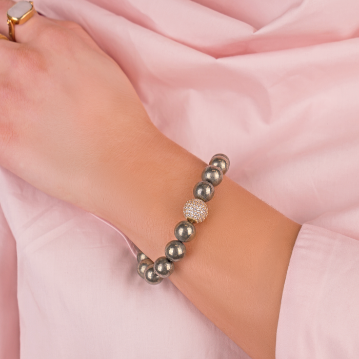 a hand wearing a bracelet