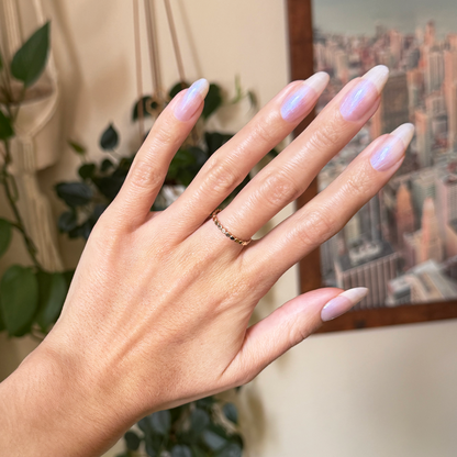 Rose Glaze - Builder Gel on natural long nails with sheer pink iridescent manicure in warm indoor setting