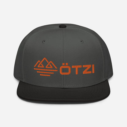 Gray and black snapback hat with orange Ötzi logo and mountain design on the front