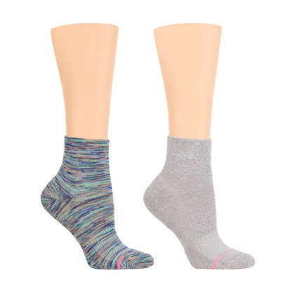 Quarter-length compression socks in multicolored and gray designs, displayed on mannequin legs.