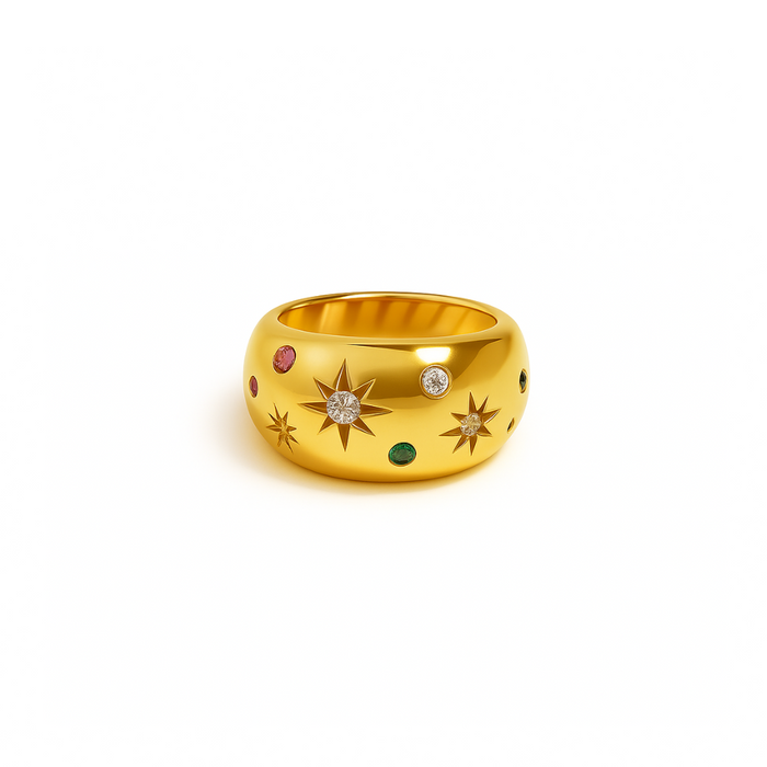 Gold signet ring with star engravings and small diamond, emerald, and ruby gemstones.