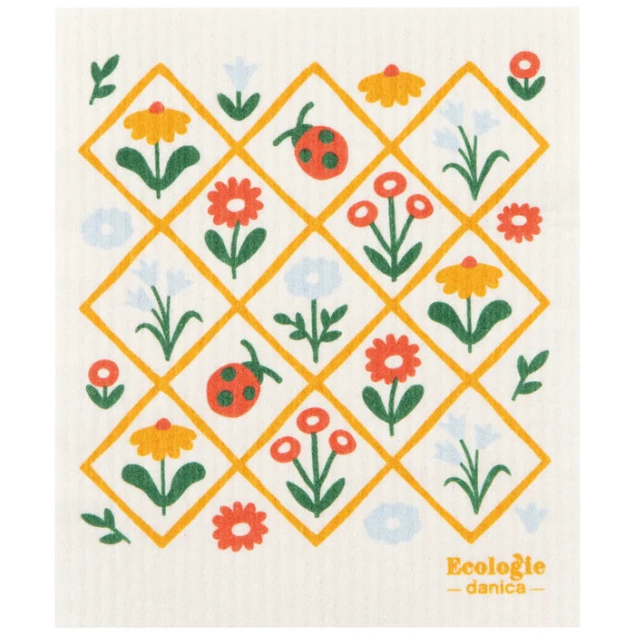 Patterned dish cloth with flowers and ladybugs on a white background, featuring the brand 'Ecologie danica'.