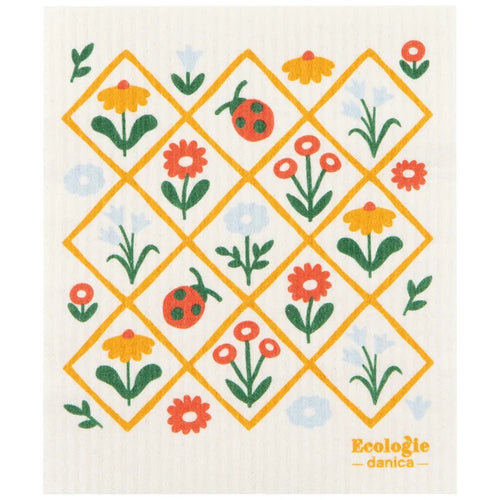 Patterned dish cloth with flowers and ladybugs on a white background, featuring the brand 'Ecologie danica'.