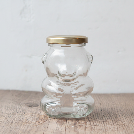 maman teddy bear glass jar with gold lid — open view on rustic wood