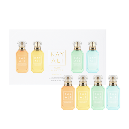Set of eight Kayali perfume bottles in various pastel colors on a white background.