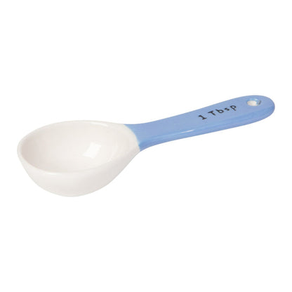 White measuring spoon with blue handle on a white background
