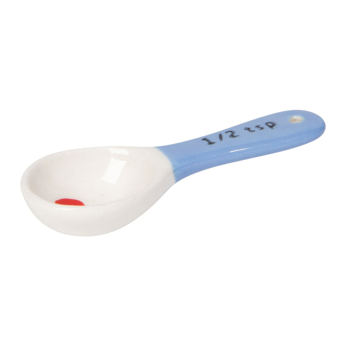 White measuring spoon with blue handle on a white background