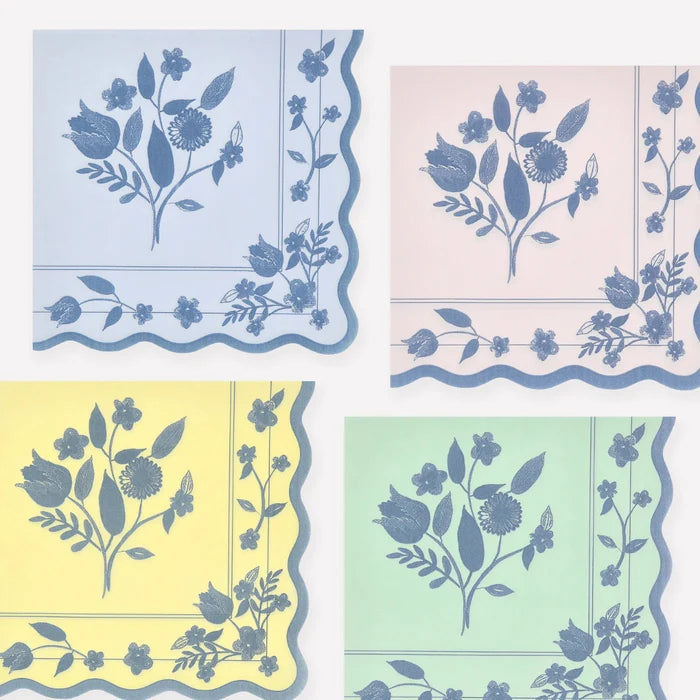 Four square napkins with floral patterns in pastel colors