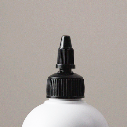 Gif showing the Violet Shampoo - Alcôve Hair coming out of the bottle