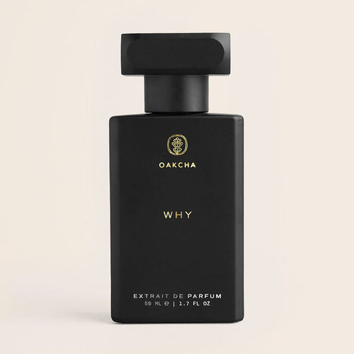 Front view of Why 50ml extrait de parfum bottle showing matte black rectangular bottle with gold Oakcha logo and WHY text on a light beige background